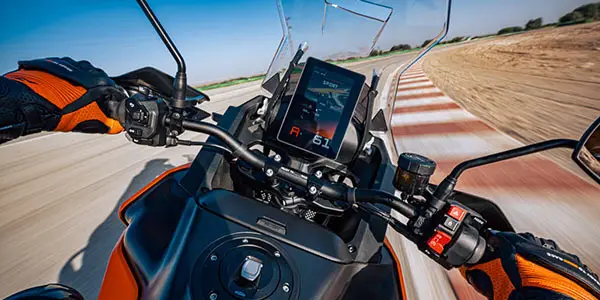 Modern motorcycle instrument cluster showing advanced electronics