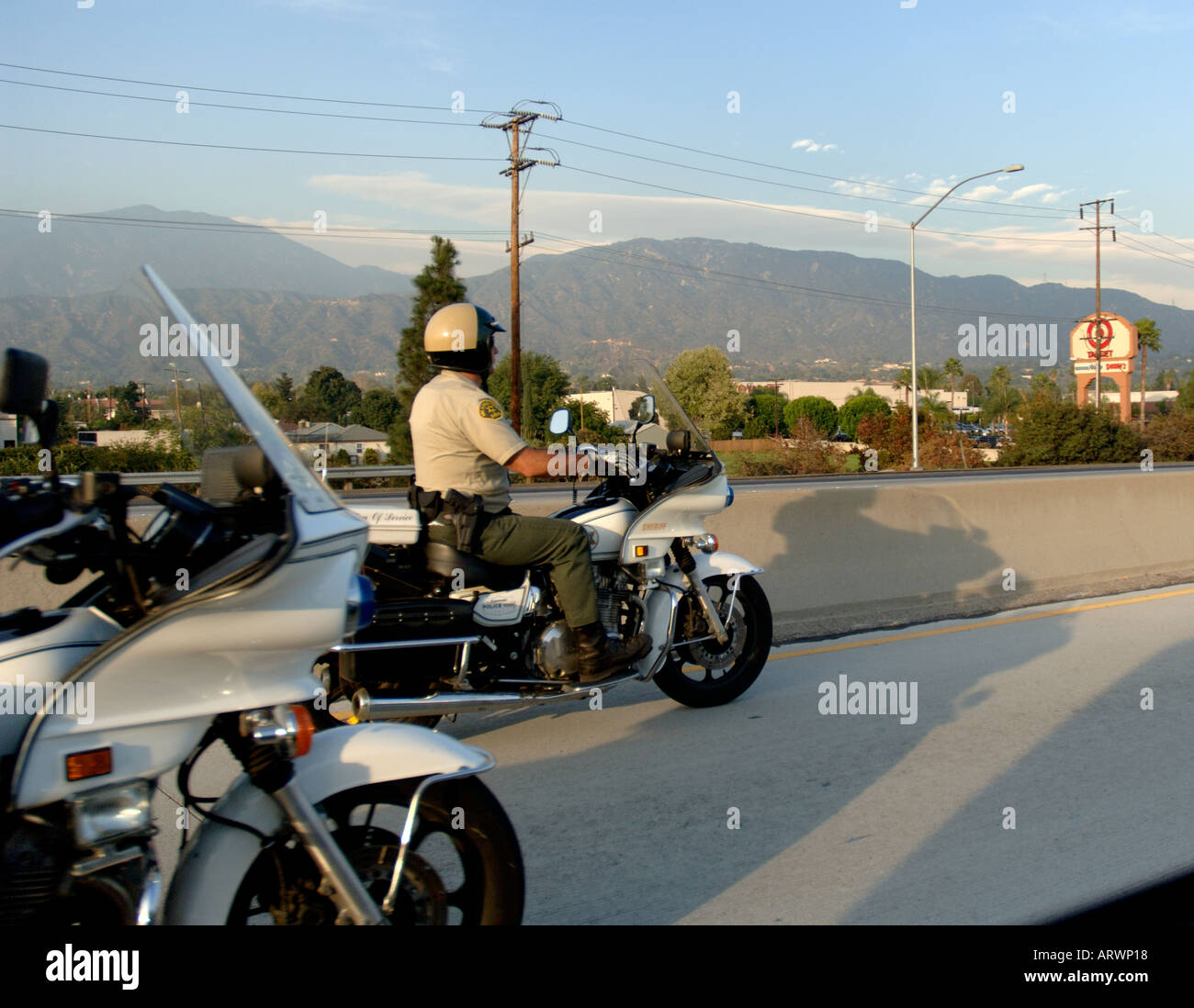 CHP motorcycle officer on California freeway, illustrating law enforcement context