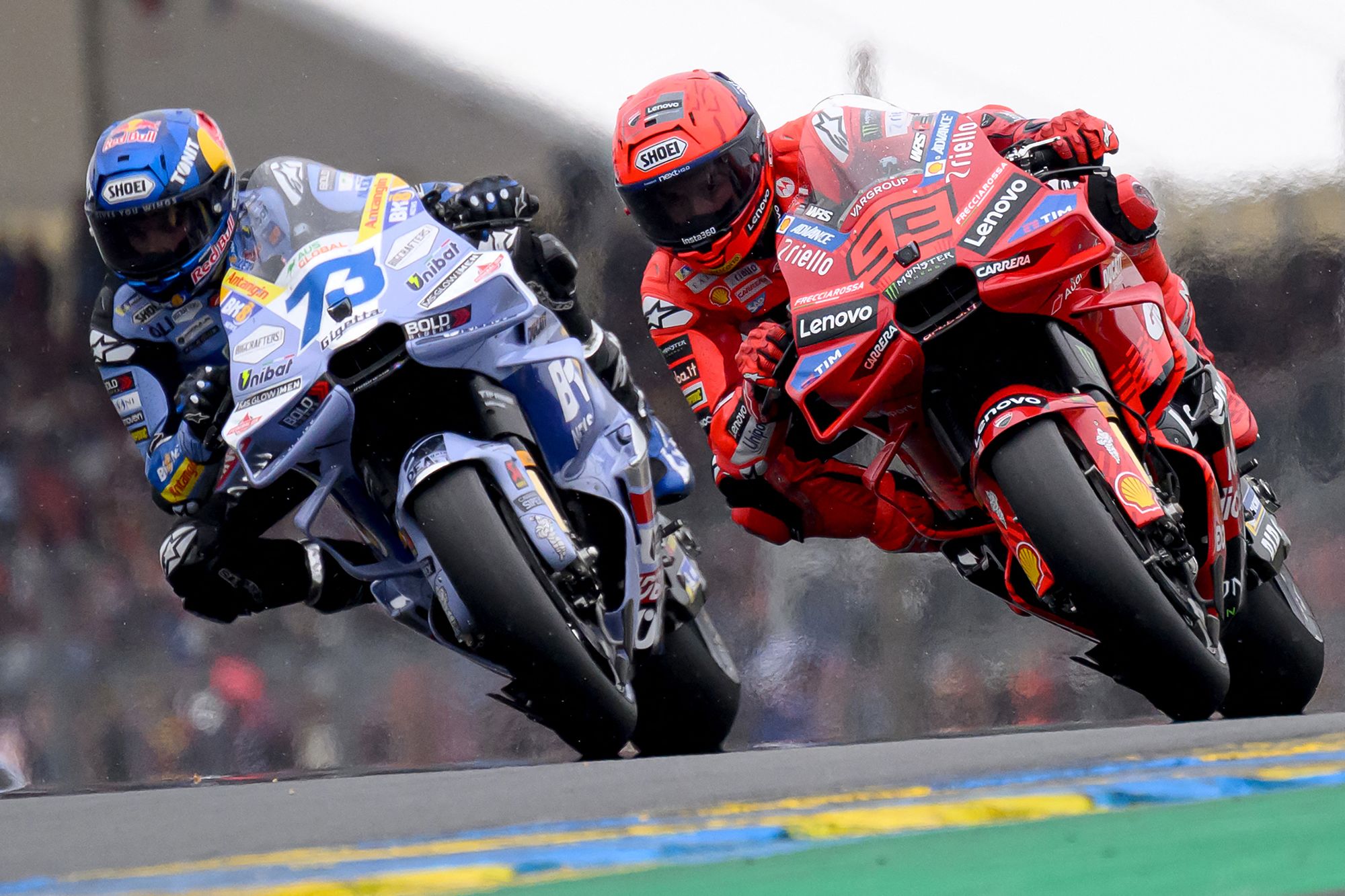 Close racing action showing two riders fighting for position