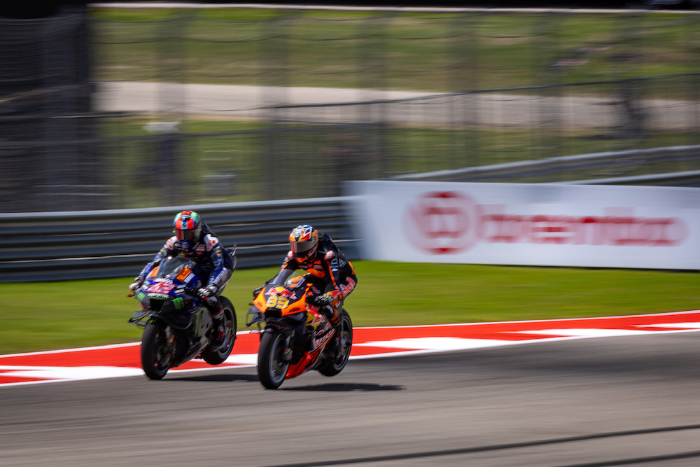Wheel-to-wheel MotoGP battle illustrating the decisive overtake