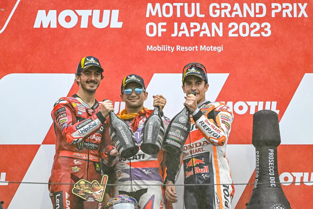 Podium celebration scene at a MotoGP Japanese Grand Prix