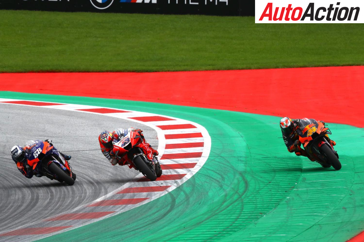 Close racing action illustrating the lap 12 battle
