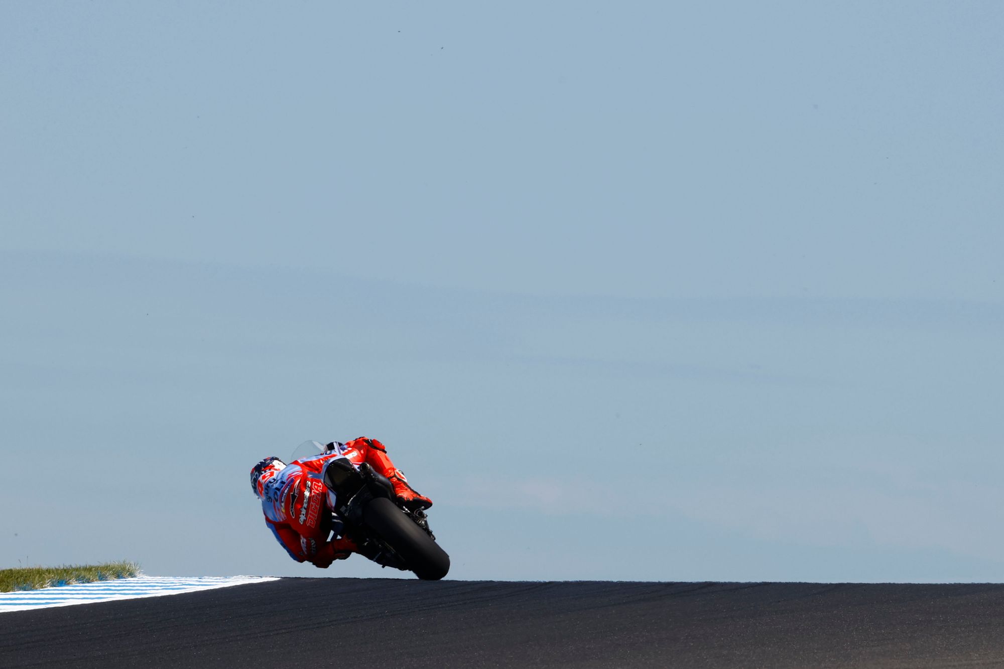 Winner celebration on podium, to accompany race results section