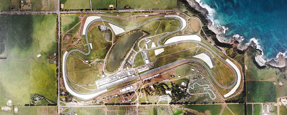 Aerial or wide shot of a modern racing circuit under development or newly built