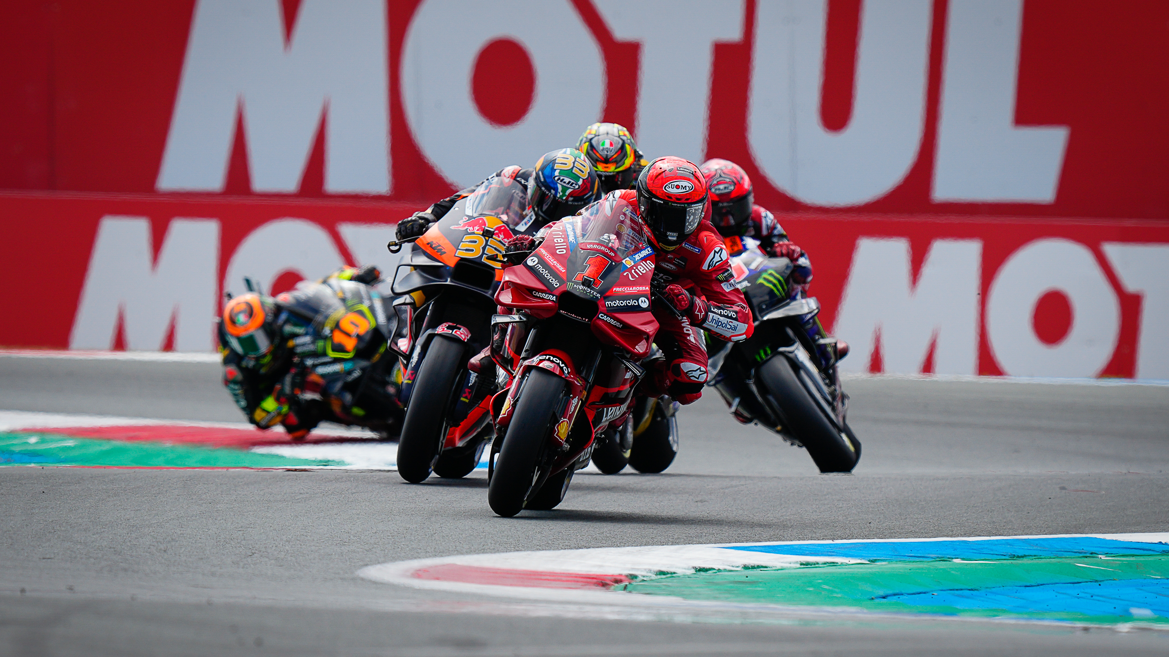 Close racing action during a MotoGP sprint race