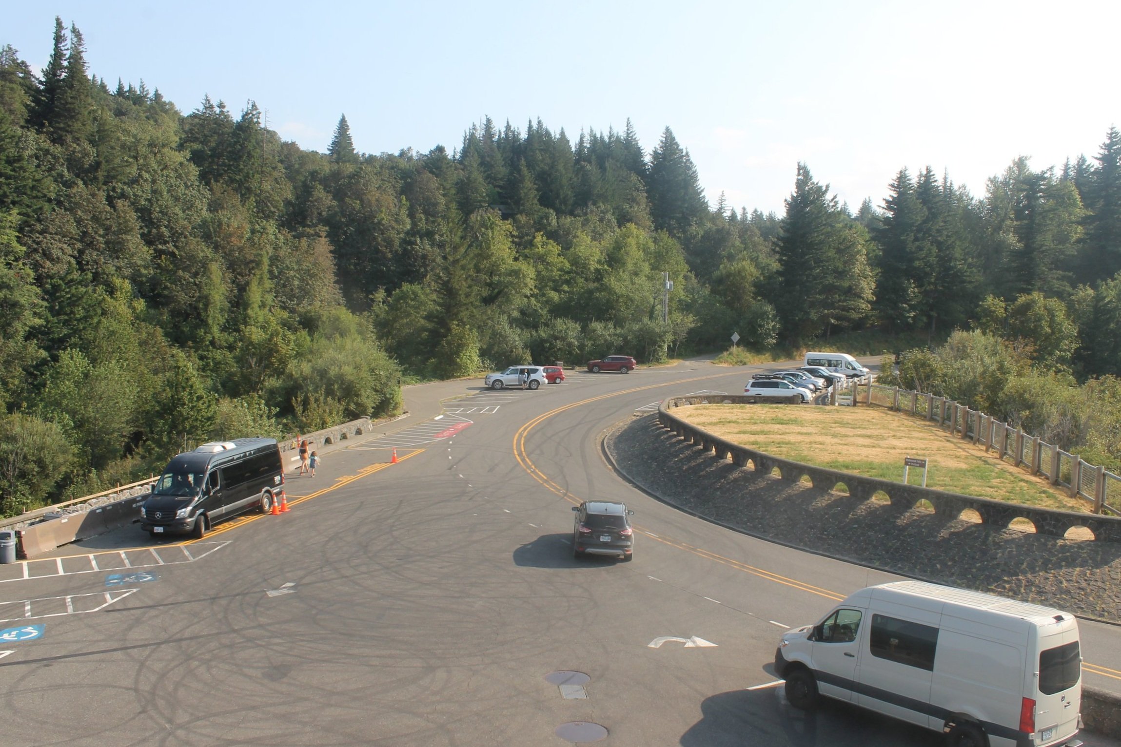 Hero image showing group of motorcycles on scenic Pacific Northwest road in autumn