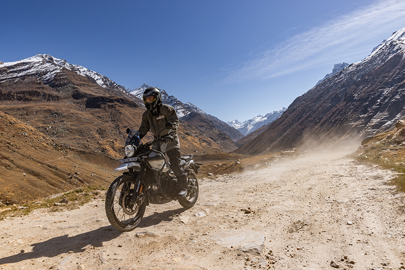 Royal Enfield adventure bike on scenic mountain or trail road