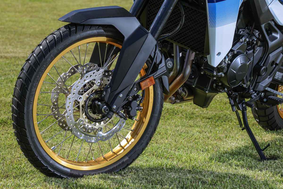 Adventure bike front wheel and long-travel fork detail