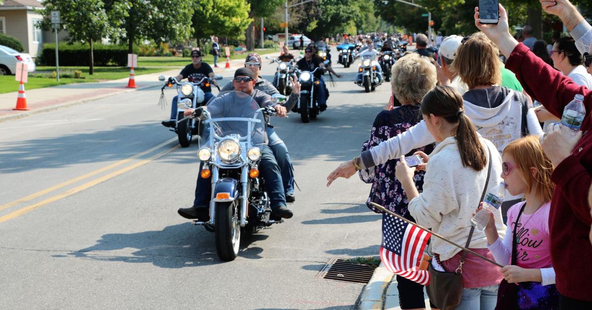 Large group of motorcycles gathered at a charity fundraiser run