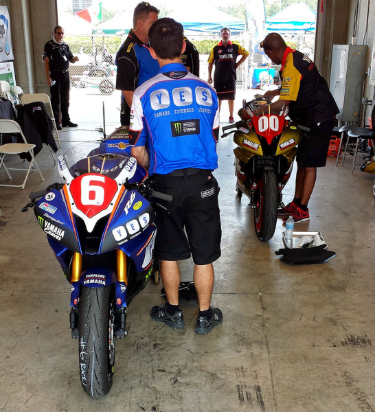 Rider getting bike inspected in the paddock before track session