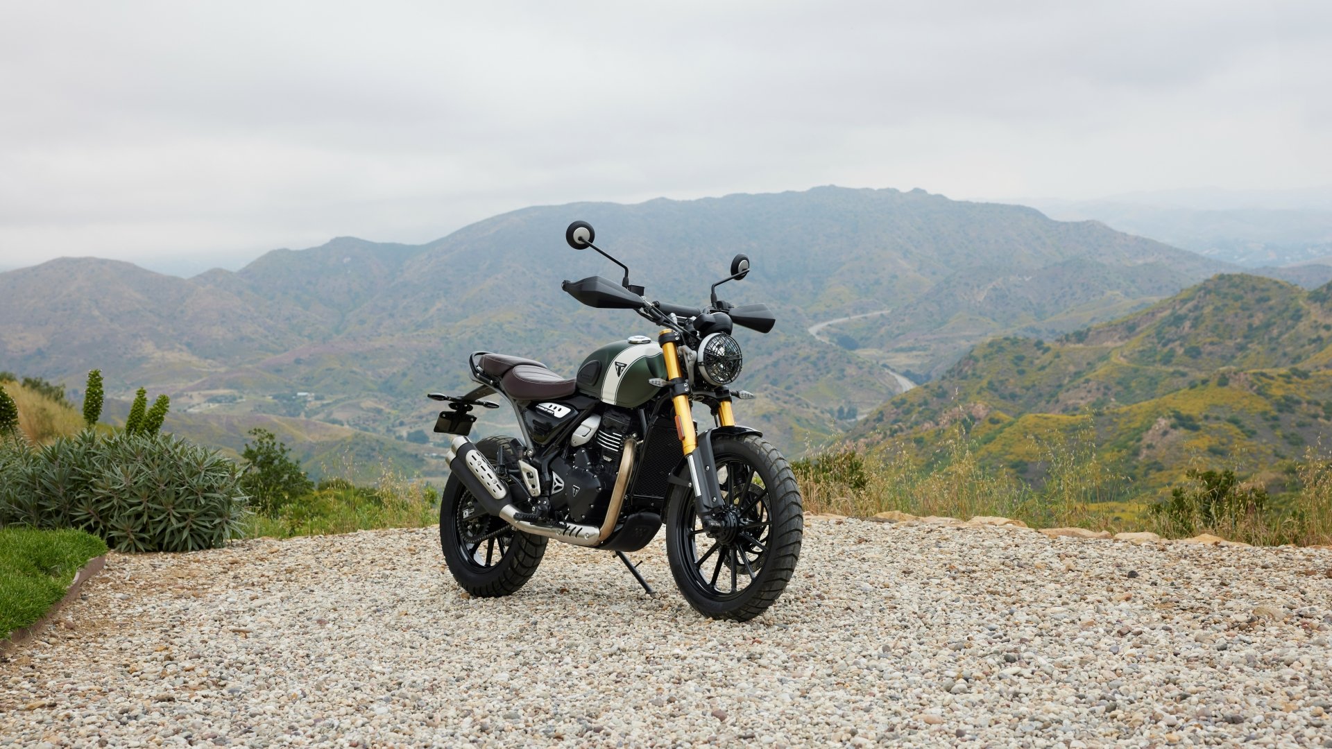 Modern scrambler on light off-road terrain