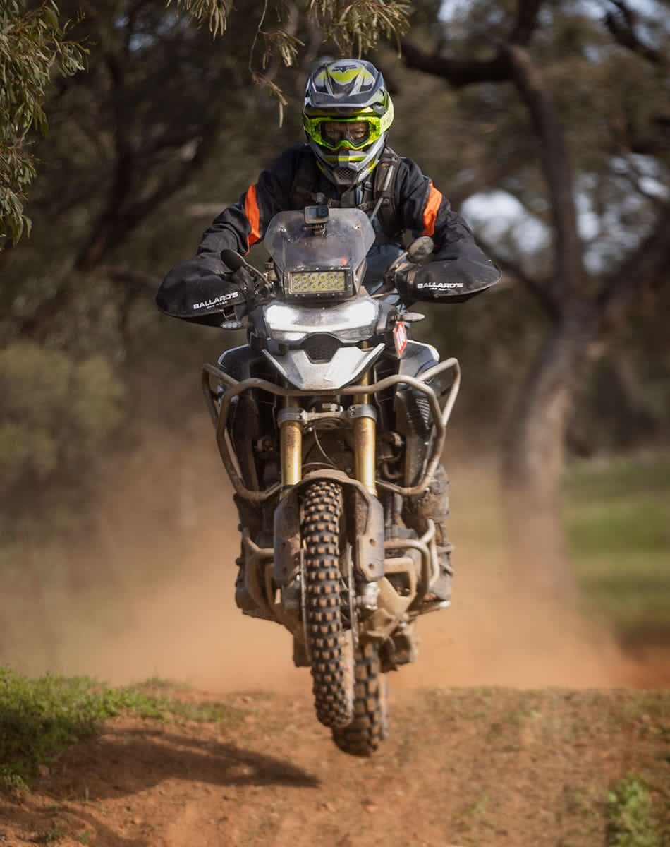 Action shot of Tiger 1200 in adventure touring terrain