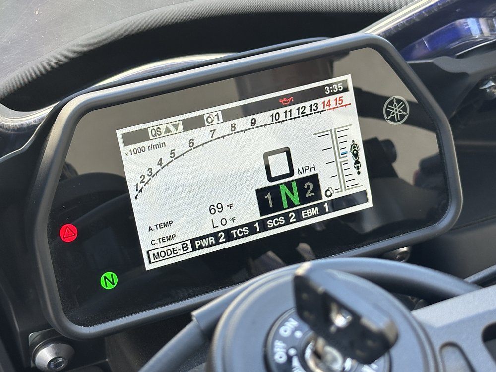 Cockpit view showing the TFT dash and electronics interface